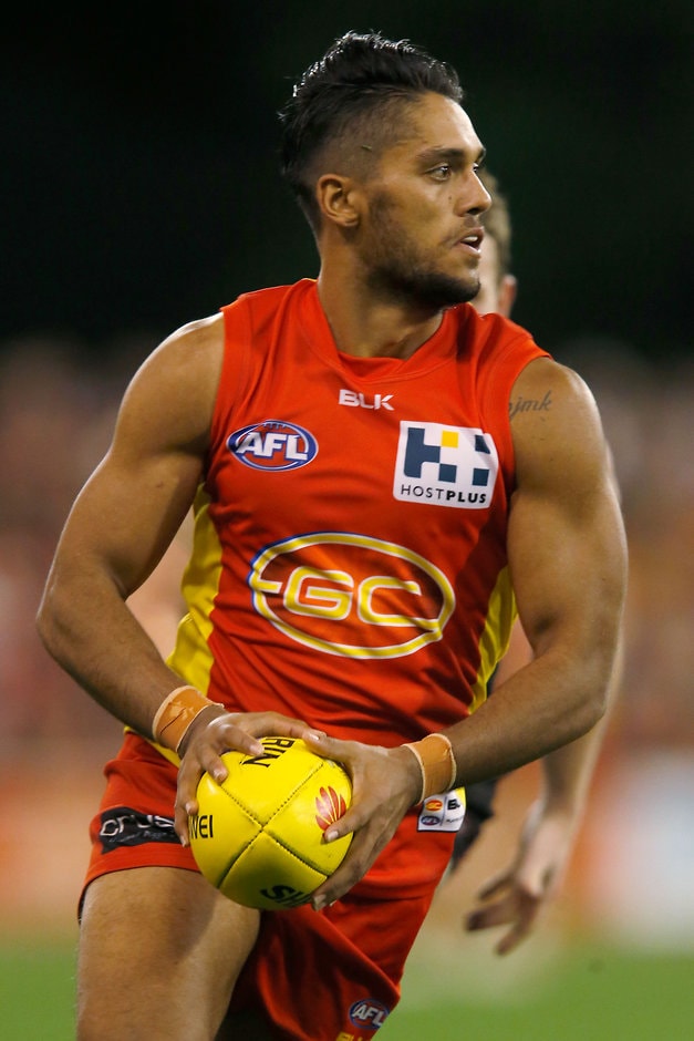 AFL 2015 Rd 21 - Gold Coast v Essendon GOLD COAST, AUSTRALIA - AUGUST 22: Aaron Hall of the Suns in action during the 2015 AFL round 21 match between the Gold Coast Suns and the Essendon Bombers at Metricon Stadium, Gold Coast, Australia on August 22, 2015. (Photo by Darrian Traynor/AFL Media)